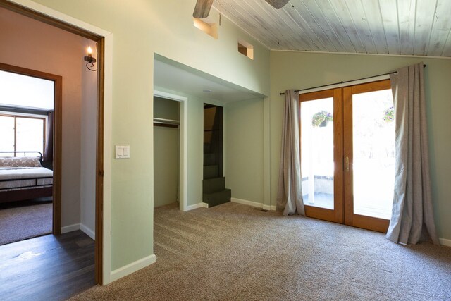 6400 Boondock Ln, Clinton, MT 59825 - unfurnished bedroom with french doors, vaulted ceiling, multiple windows, access to exterior, and wood ceiling