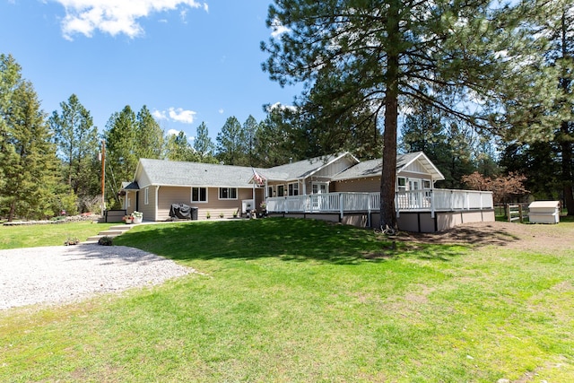 6400 Boondock Ln, Clinton, MT 59825 - rear view of house with a yard and a wooden deck