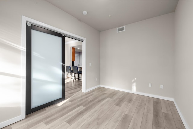 6002 St Moritz Dr Unit A, Whitefish, MT 59937 - empty room featuring light wood finished floors, baseboards, and a smoke detector