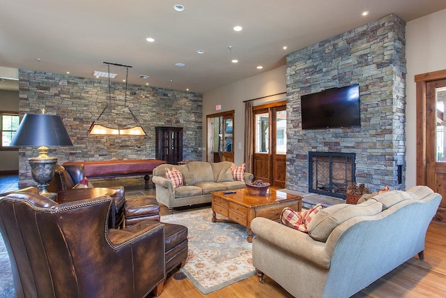 6002 St Moritz Dr Unit A, Whitefish, MT 59937 - living area with a fireplace, recessed lighting, and wood finished floors
