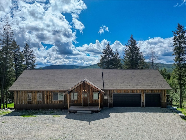 200 Lakeview Ter, Marion, MT 59925 - view of front of house featuring a garage, driveway, and board and batten siding