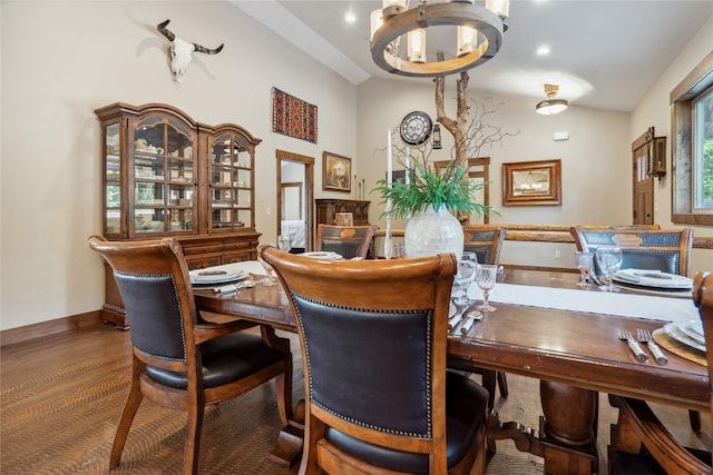 200 Lakeview Ter, Marion, MT 59925 - dining space with a chandelier, vaulted ceiling, baseboards, and wood finished floors