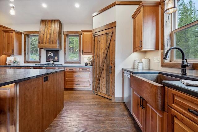 200 Lakeview Ter, Marion, MT 59925 - kitchen with dark wood-style flooring, a sink, appliances with stainless steel finishes, brown cabinets, and recessed lighting