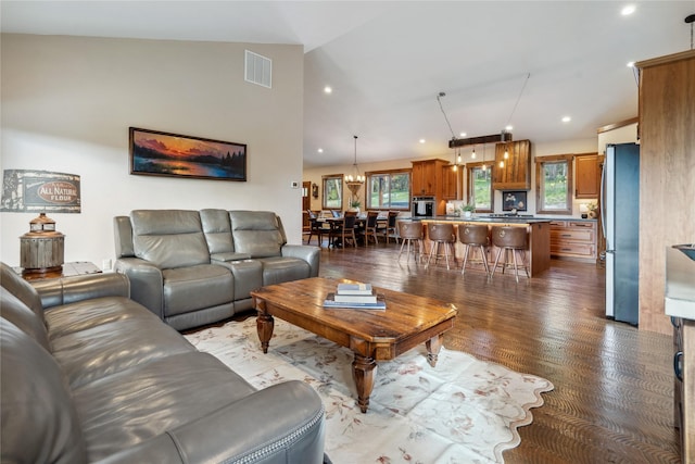 200 Lakeview Ter, Marion, MT 59925 - living room with dark wood-style floors, recessed lighting, and vaulted ceiling