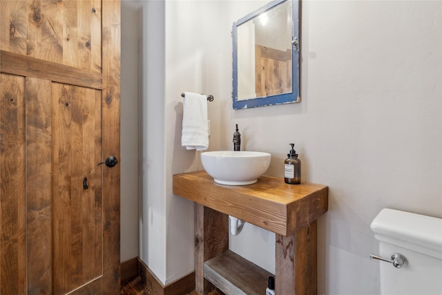 200 Lakeview Ter, Marion, MT 59925 - bathroom with a sink, toilet, and baseboards