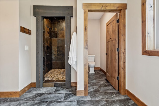 200 Lakeview Ter, Marion, MT 59925 - full bath with baseboards, tiled shower, and toilet