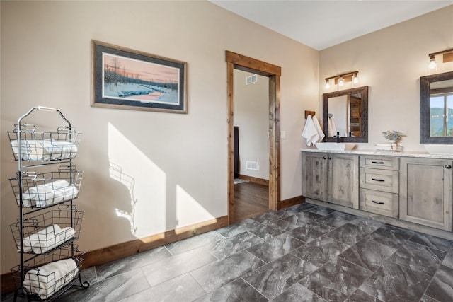 200 Lakeview Ter, Marion, MT 59925 - bathroom featuring baseboards and double vanity