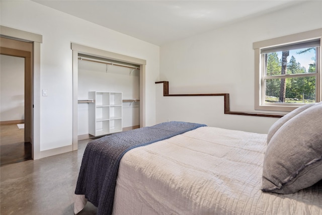 200 Lakeview Ter, Marion, MT 59925 - bedroom featuring concrete flooring, a closet, and baseboards