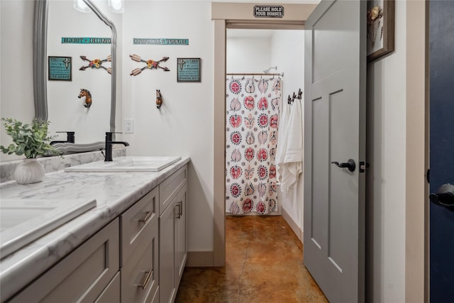 200 Lakeview Ter, Marion, MT 59925 - bathroom featuring finished concrete floors, double vanity, a shower with curtain, and baseboards