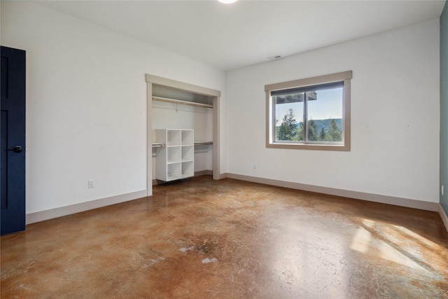 200 Lakeview Ter, Marion, MT 59925 - unfurnished bedroom with finished concrete floors, baseboards, and a closet