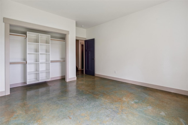 200 Lakeview Ter, Marion, MT 59925 - unfurnished bedroom featuring finished concrete flooring, a closet, and baseboards