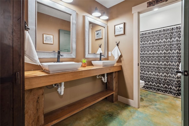 200 Lakeview Ter, Marion, MT 59925 - bathroom featuring a sink, finished concrete flooring, toilet, and a shower with shower curtain