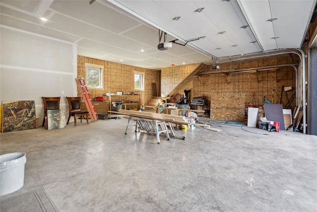 200 Lakeview Ter, Marion, MT 59925 - garage featuring a garage door opener and a workshop area