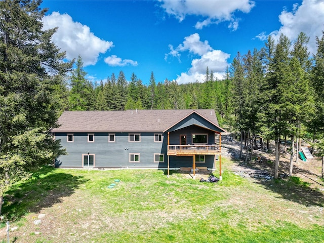200 Lakeview Ter, Marion, MT 59925 - rear view of house featuring a lawn, a view of trees, and a wooden deck