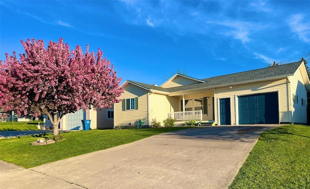 4 Weber Ave, Polson, MT 59860 - single story home with a garage, a porch, driveway, and a front yard