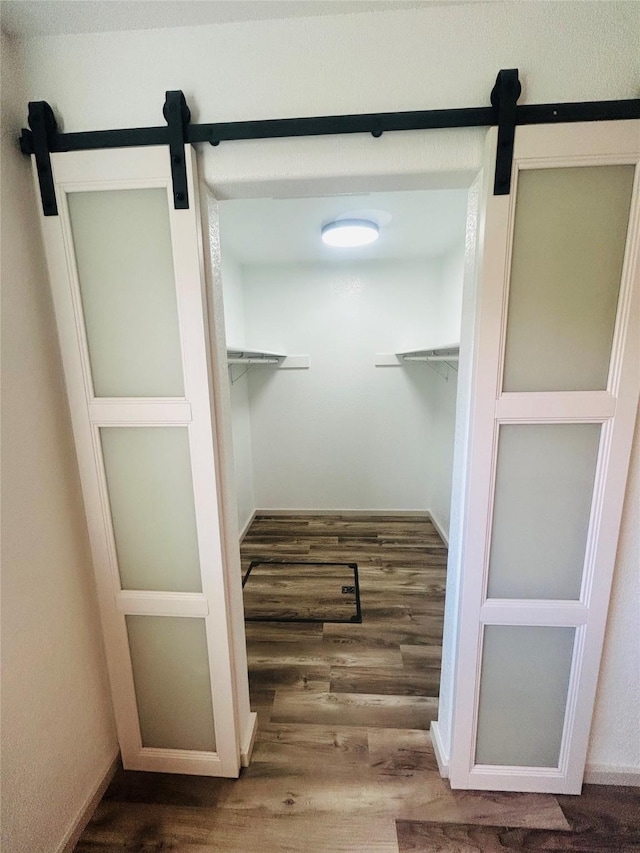 4 Weber Ave, Polson, MT 59860 - walk in closet with a barn door and wood finished floors
