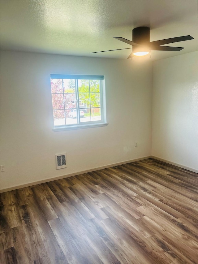 4 Weber Ave, Polson, MT 59860 - unfurnished room featuring a ceiling fan, wood finished floors, and baseboards