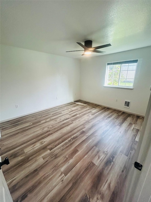4 Weber Ave, Polson, MT 59860 - unfurnished room featuring wood finished floors, ceiling fan, and a textured ceiling