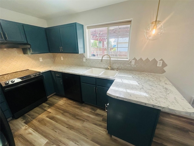 4 Weber Ave, Polson, MT 59860 - kitchen with black range with electric cooktop, a sink, under cabinet range hood, and dark wood-style flooring