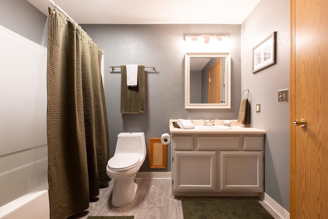 2504 Blackthorn Dr, Missoula, MT 59803 - bathroom with toilet, baseboards, vanity, and shower / tub combo
