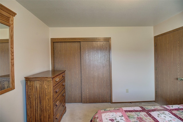 bedroom with light carpet