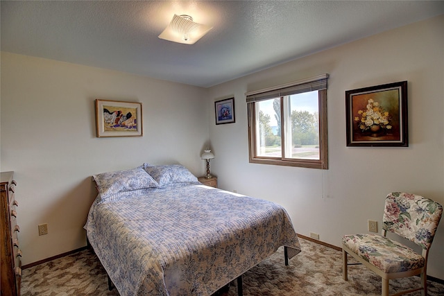 carpeted bedroom featuring baseboards