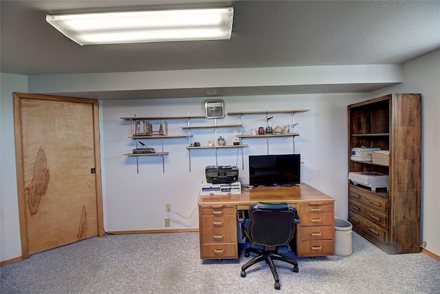 home office featuring light carpet and baseboards