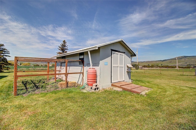 view of shed with a rural view