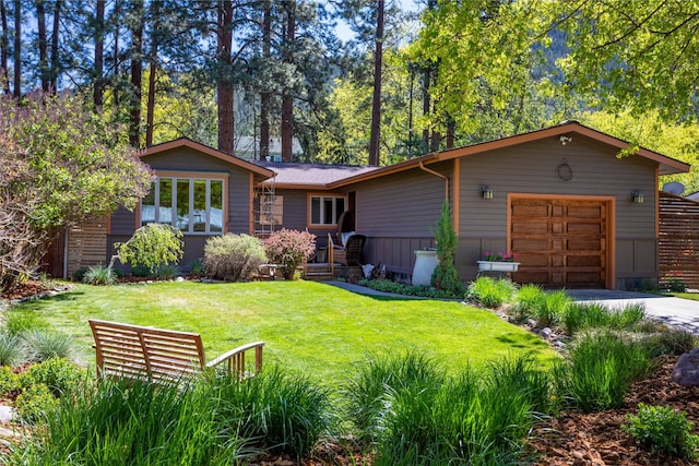 2406 Raymond Ave, Missoula, MT 59802 - view of front of home with a front yard, concrete driveway, and an attached garage