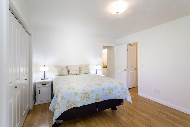 2406 Raymond Ave, Missoula, MT 59802 - bedroom with a closet, wood finished floors, and baseboards