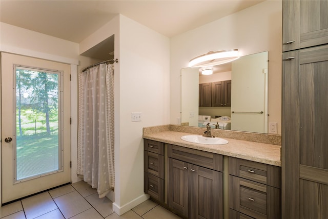 2406 Raymond Ave, Missoula, MT 59802 - bathroom featuring tile patterned floors, vanity, and baseboards