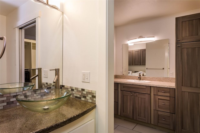 2406 Raymond Ave, Missoula, MT 59802 - bathroom with tasteful backsplash, vanity, and tile patterned flooring