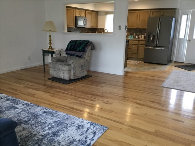 403 S Cherry St, Townsend, MT 59644 - living area featuring light wood-type flooring and baseboards