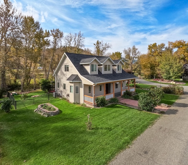 5235 Creekside Ln, Helena, MT 59601 - cape cod house with a porch, a front yard, and a shingled roof