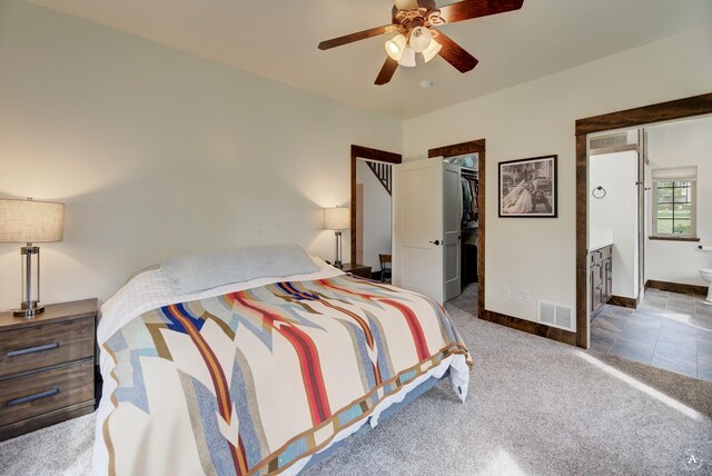 5235 Creekside Ln, Helena, MT 59601 - carpeted bedroom featuring a spacious closet, baseboards, ensuite bathroom, a closet, and a ceiling fan