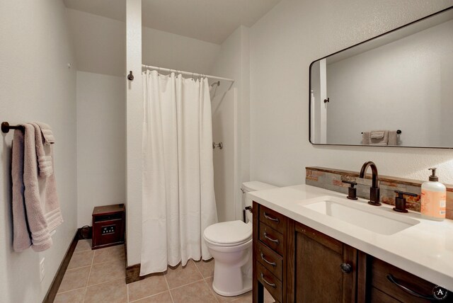 5235 Creekside Ln, Helena, MT 59601 - bathroom with toilet, vanity, tile patterned floors, and a shower with shower curtain
