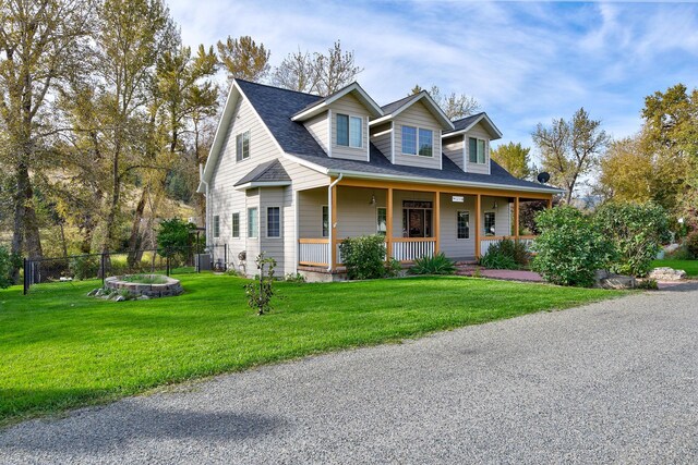 5235 Creekside Ln, Helena, MT 59601 - cape cod-style house with covered porch and roof with shingles
