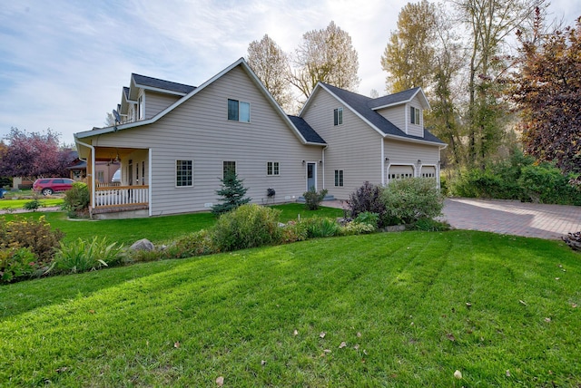 5235 Creekside Ln, Helena, MT 59601 - view of home's exterior featuring a lawn, driveway, and an attached garage