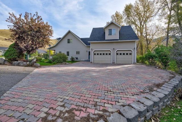 5235 Creekside Ln, Helena, MT 59601 - view of front of home featuring decorative driveway and an attached garage
