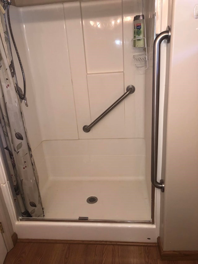 470 Duck Lake Rd, Browning, MT 59417 - full bathroom with a stall shower and wood finished floors