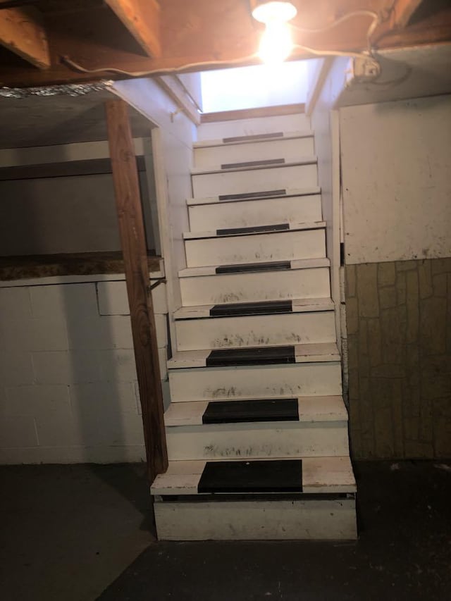 470 Duck Lake Rd, Browning, MT 59417 - stairway with concrete block wall and concrete flooring