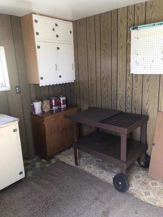 470 Duck Lake Rd, Browning, MT 59417 - dining room featuring wood walls and carpet