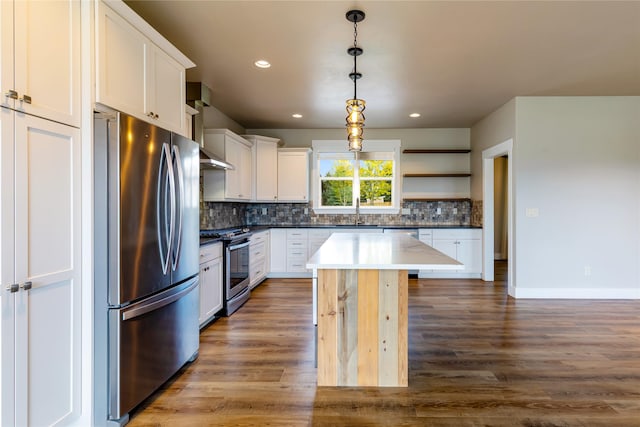 kitchen featuring appliances with stainless steel finishes, open shelves, backsplash, wood finished floors, and recessed lighting