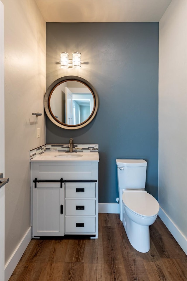 bathroom featuring baseboards and wood finished floors