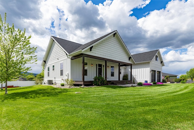 view of front of property featuring board and batten siding, covered porch, roof with shingles, a garage, and central AC unit