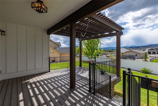 view of patio / terrace with a pergola, a residential view, and a wooden deck