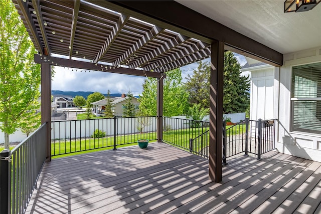 deck featuring a pergola and a residential view