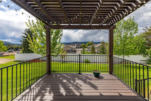 wooden deck featuring a pergola, a residential view, and a mountain view