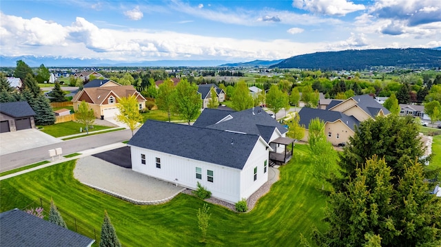 aerial perspective of suburban area featuring a mountainous background