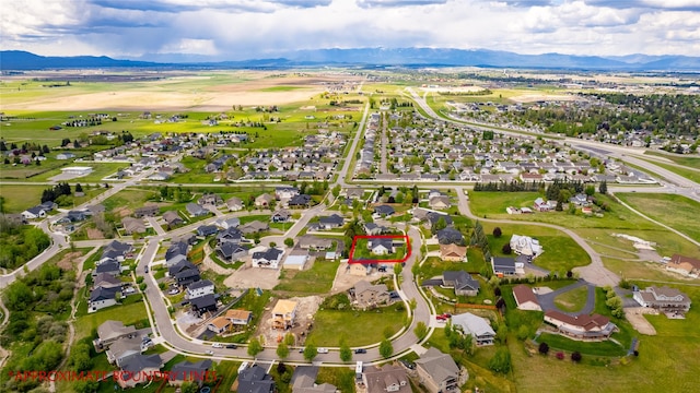 aerial perspective of suburban area with a mountain backdrop